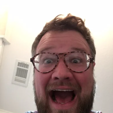 Ramp making an excited face at the camera in glasses